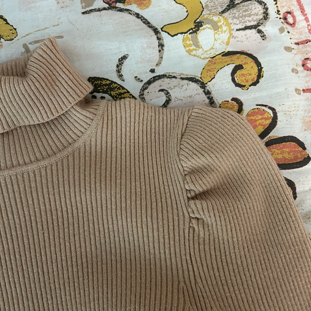 Soft cream turtleneck with puff sleeves